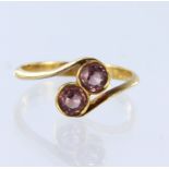 22ct yellow gold two stone crossover style ring set with two round pink tourmalines measuring