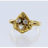 Yellow metal stamped 18ct, diamond trefoil shield ring, set with three old-mine cut diamonds gross