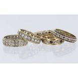 Five eternity rings to include all test as 9ct yellow gold, all set with paste stones. Total