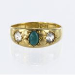 18ct yellow gold ring set with a central oval turquoise measuring approx. 6mm x 4mm, with a round cz