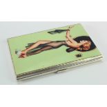 Silver and enamel cigarette case, depicting a bare chested woman wearing a green negligee,