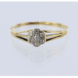 18ct yellow gold daisy cluster ring set with seven round brilliant cut diamonds, total diamond