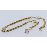 9ct yellow gold rope link bracelet set with three oval blue topaz measuring approx. 6mm x 5mm,