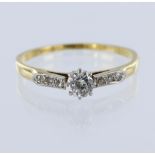 18ct yellow gold and platinum ring set with a round brilliant cut diamond weighing approx. 0.33ct,