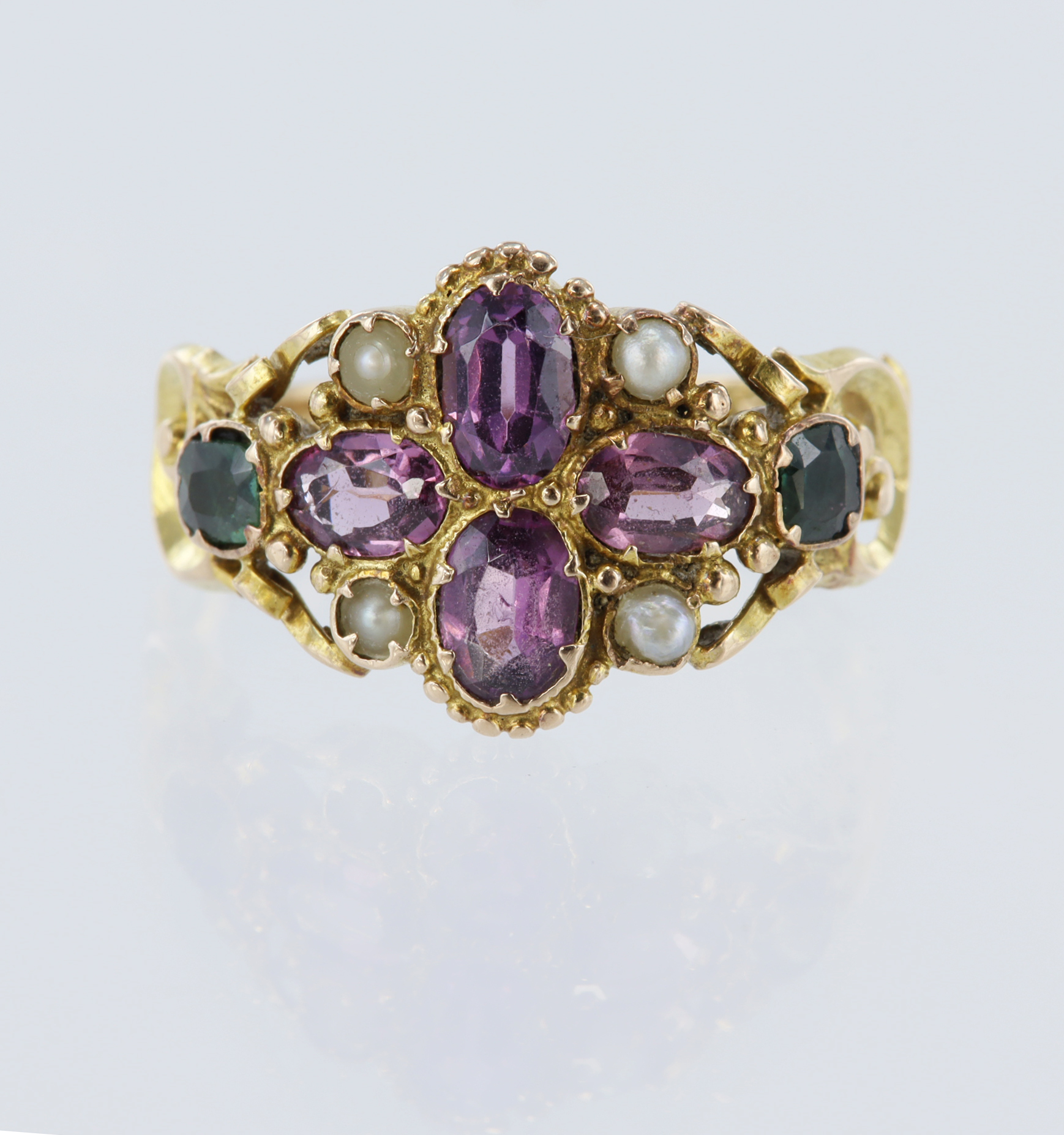 15ct yellow gold ring set with four oval pink tourmalines measuring approx. 4.5mm x 3mm, two green