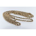 Ladies yellow metal (tests as 9ct) "Muff" style chain, Length over 150cm, weight 32.7g