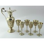 Silver wine jug and six silver cups, with scroll decoration, hallmarked 'CSG&Co., Birmingham, 1975-
