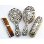 Mixed silver mounted dressing table set comprising hand mirror (hallmarked C&S Birm 1905); two