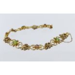 15ct yellow gold bracelet set with three 6mm round peridot stones and three 4mm round pink