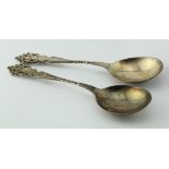 Two spoons with decorative handles and twist stems, hallmarked C.E, London 1899', length 21.5cm,