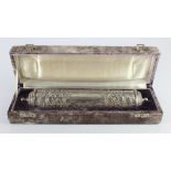 White metal scroll holder / case (tests as 900 silver), with scrolling floral decoration,