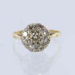 Tested 18ct yellow gold cluster ring, set with nine diamonds, principle round cut weighing approx