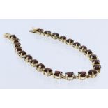 10kt Gold stamped garnet bracelet, length 19.5cm approx., weight 7g approx.