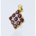 18ct yellow gold pendant set with nine rubies and four diamond highlights, total diamond weight 0.