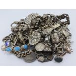 Assortment of mixed silver/ white metal charm bracelets, bracelets and other jewellery. Total weight