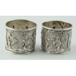 Two Chinese unmarked silver napkin rings each showing four immortals c.1900. Total weight 1.25oz