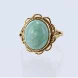 9ct yellow gold ring set with an oval hardstone cabochon measuring approx. 12mm x 10mm, finger