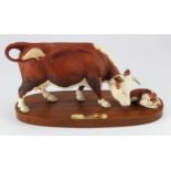 Beswick Connoisseur. Hereford cow & calf by Beswick, mounted on a wooden plinth, height 16cm, length