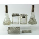 Three silver topped glass toilet jars and two silver topped glass perfume bottles (both missing