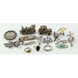 Mixed lot of silver jewellery comprising ten brooches, three rings and two silver models (train