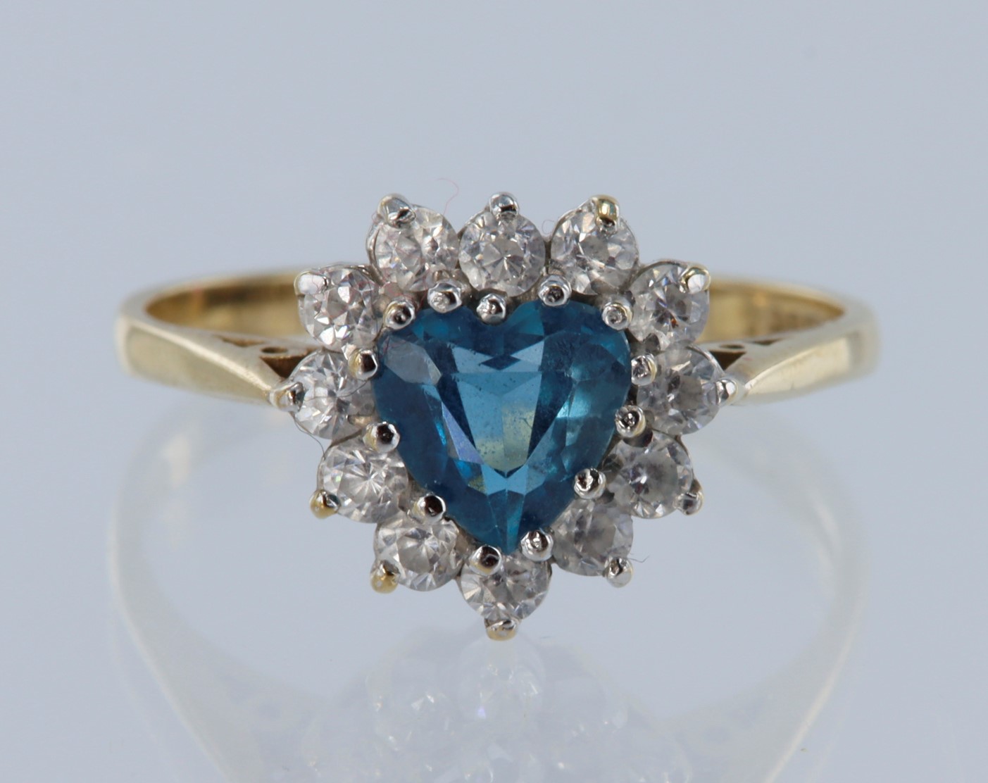 9ct yellow gold, cluster ring, heart shaped Swiss blue topaz measuring approx 12mm x 6mm, set with