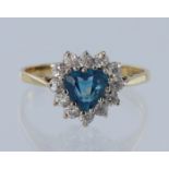 9ct yellow gold, cluster ring, heart shaped Swiss blue topaz measuring approx 12mm x 6mm, set with