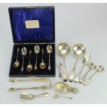 Mixed silver. A group of various silver hallmarked spoons, sugar tongs etc., silver weight 8.6oz.