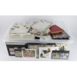 Large clear plastic crate packed with various loose stamps in stockbooks, tub, covers, etc. (Qty)