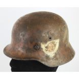 German M35 steel helmet badged to the SA Brownshirts, considerable wear, but complete with liner.