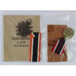 German Nazi War Merit medal in packet of issue with War Merit Cross 2nd class with swords in