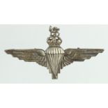 Badge an unhallmarked but silver ? Parachute Regiment cap badge Kings Crown.