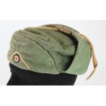 German Winter cap, a Whermacht interesting M43 cap with peak sewn upwards with badges and white