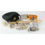 Omani armed forces service dress cap, with a selection of various Omani badges, buttons, belts, etc.