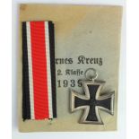 German Iron Cross 2nd class WW2 in paper packet and with unused ribbon, ring maker stamped.