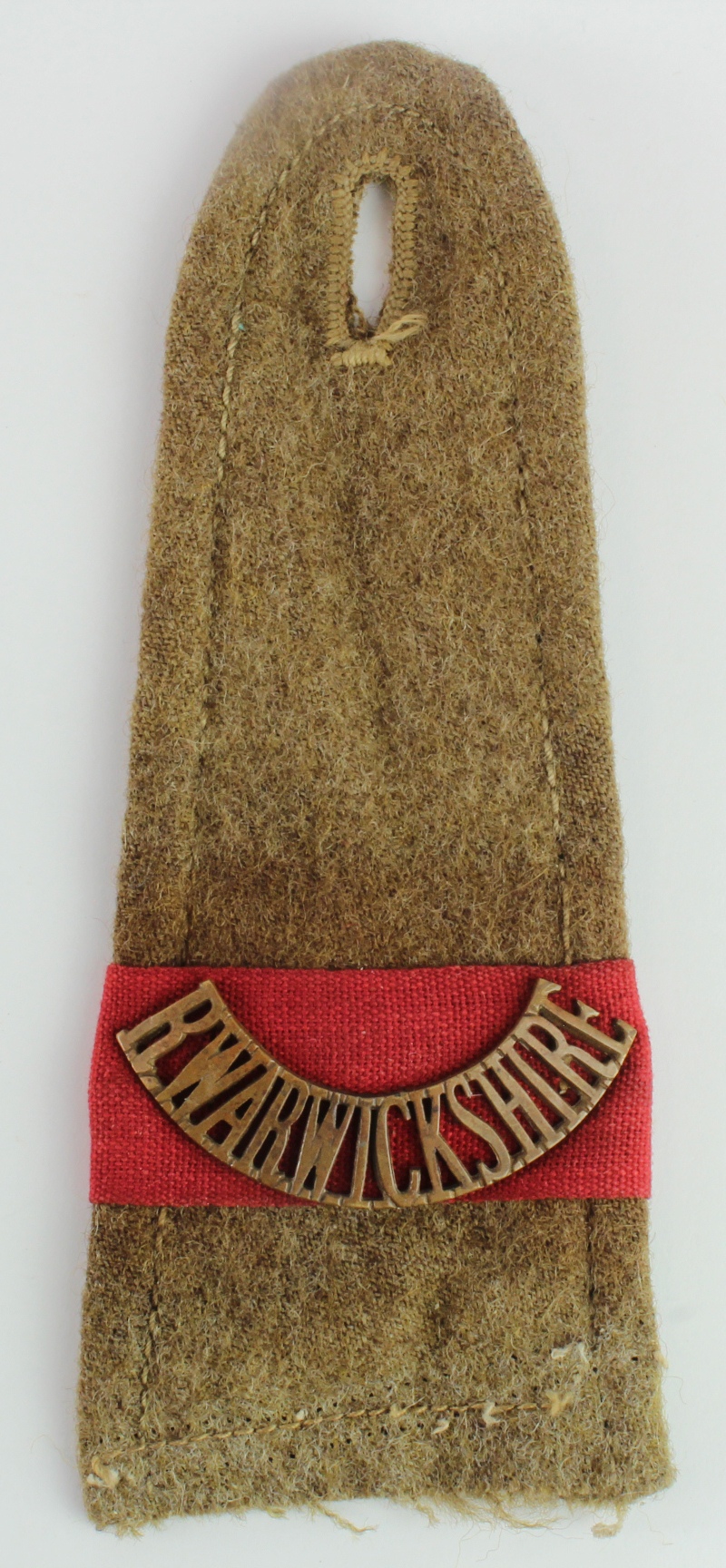 Badge a WW1 shoulder strap with Royal Warwickshire shoulder title over a red flash (Platoon /