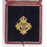 Football Medal (25mm) with pin fitting by Vaughton & Son, in original fitted case. Named to "E