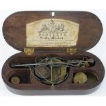Coin Scales: Victorian wooden cased set including sovereign and apothecary weights (one hinge