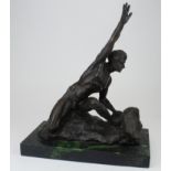 Bronze figure of a male nude. Signed (unclear) On a marble base. Height measures approx 32cm from