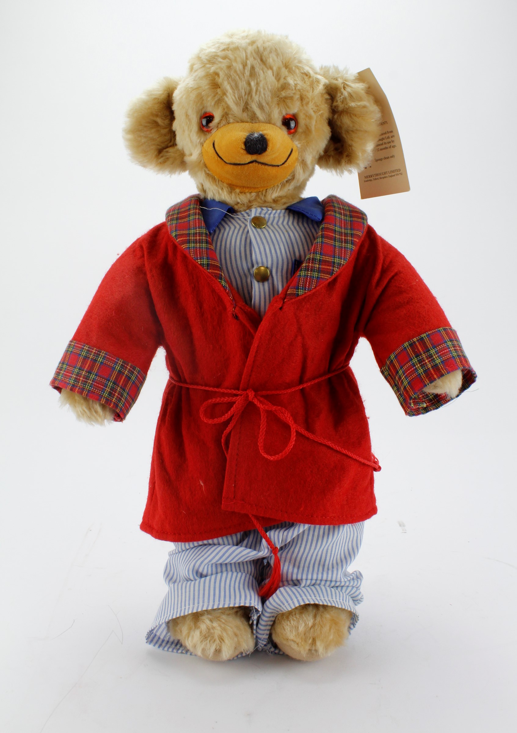 Merrythought Mohair teddy bear wearing a dressing gown, original label to foot and tag in ear,