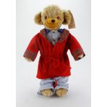 Merrythought Mohair teddy bear wearing a dressing gown, original label to foot and tag in ear,