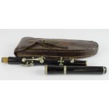 Henry Potter two piece piccolo, length 39cm approx., in a contemporary leather case