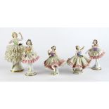 Figures. Five Continental porcelain figures, circa 19th Century, each with flowers, various makers