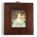 Miniature 19th century watercolour portrait of a lady. Unsigned. Glazed in a wooden frame.