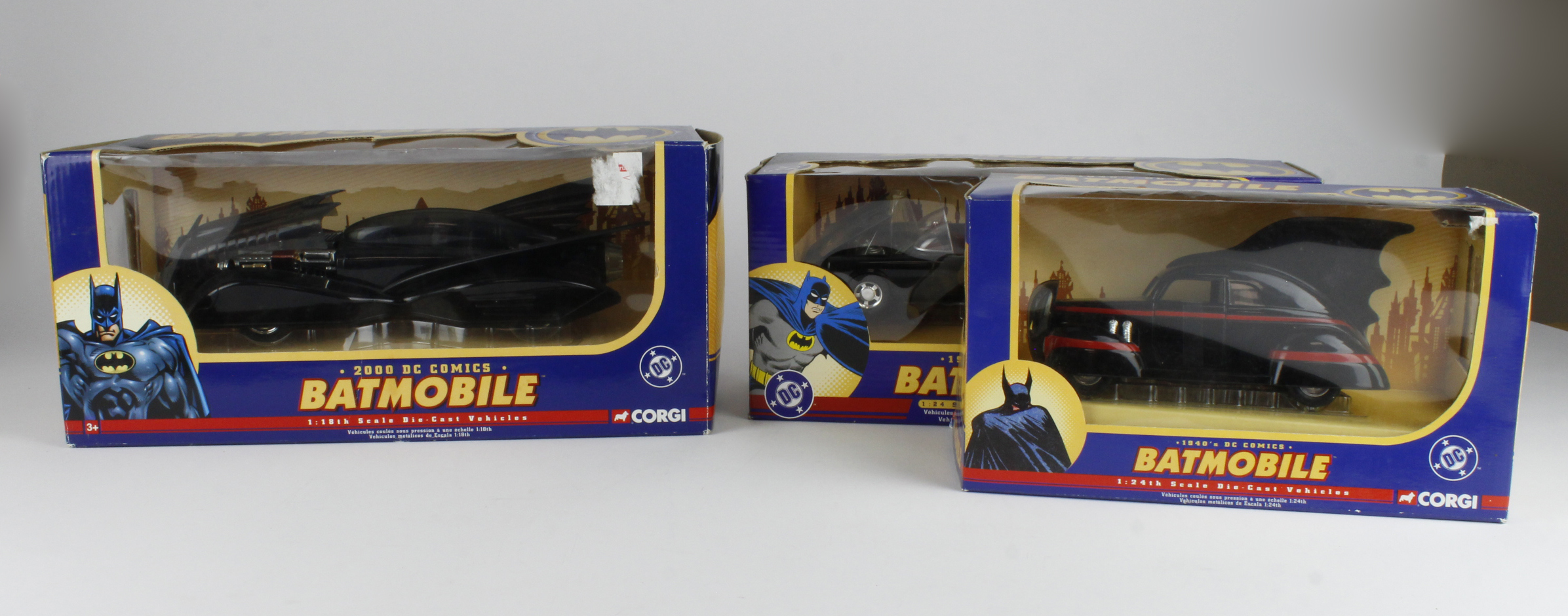 Corgi. Three boxed DC Comics diecast Batmobile, comprising the 1940s, 1960s & 2000 (sold as seen)