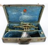 Conn trumpet with mouthpiece, contained in a Conn case