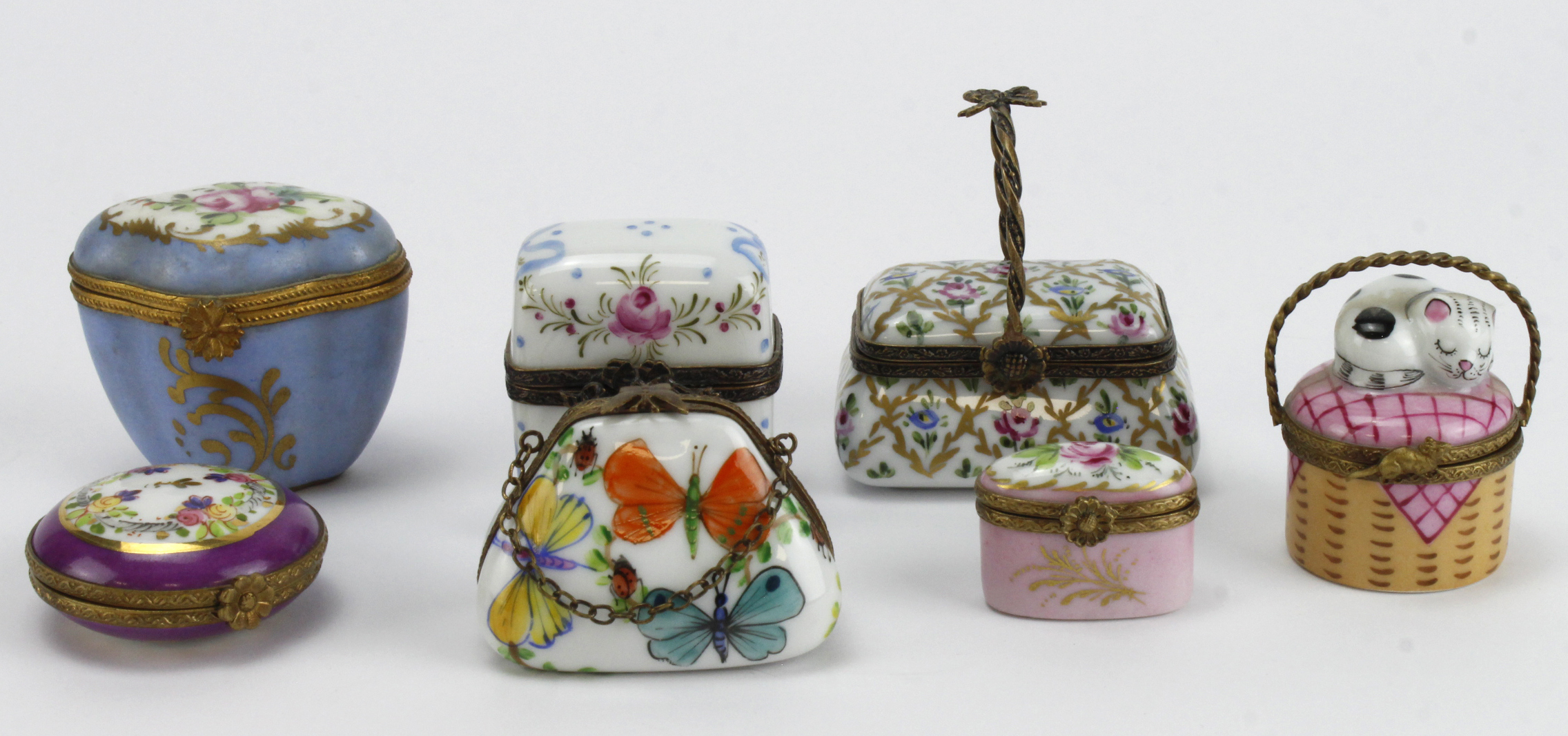 Limoges. A group of Seven hand painted trinket boxes, mostly signed Limoges, largest height 60mm,