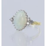 18ct yellow gold opal and diamond dress ring, oval cabochon cut opal measures 13.5mm x 9.8mm,