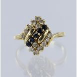 Yellow gold (tests 14ct) sapphire and CZ cluster ring, five round mix cut dark blue sapphires each
