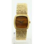Ladies 18ct gold cased Piaget manual wind wristwatch. The wood effect dial with an integral 18ct