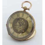 Ladies 18ct open face pocket watch. The gilt dial with foliate engraved decoration and black roman